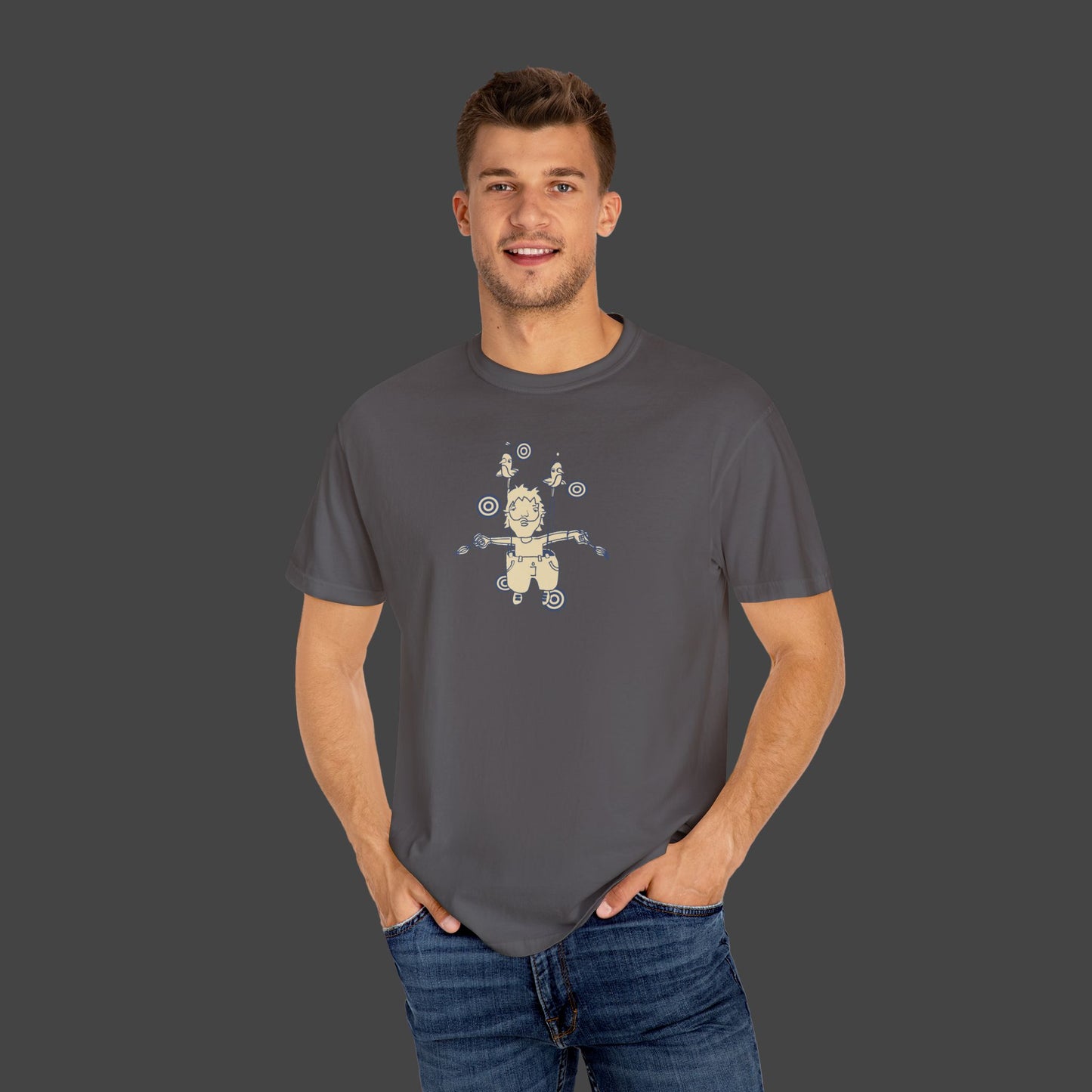 A man smiles with his hands in his jeans pockets, wearing a unisex The Day I Learned to Fly T-shirt in grey by Jarrod Eastman.