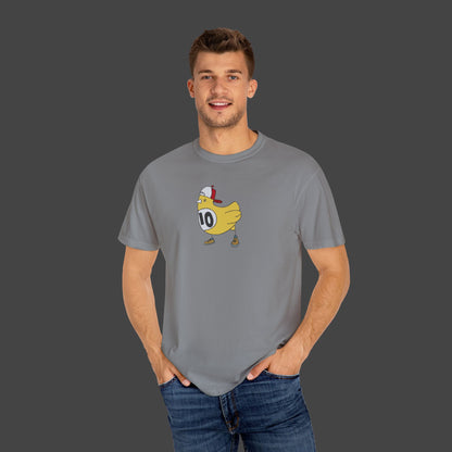 A smiling man wears the Chicken Scratch Unisex T-shirt by Jarrod Eastman from Printify, featuring a surreal and fun cartoon chicken in a helmet and shoes with the number 10, all set against a solid gray background.