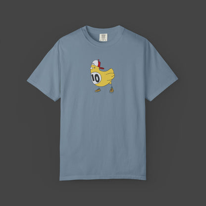 The Chicken Scratch Unisex T-shirt by Jarrod Eastman from Printify features a cartoon yellow bird in a red-and-white cap, brown shoes, and a #10 bib—delivering a surreal, fun design on this garment-dyed tee.