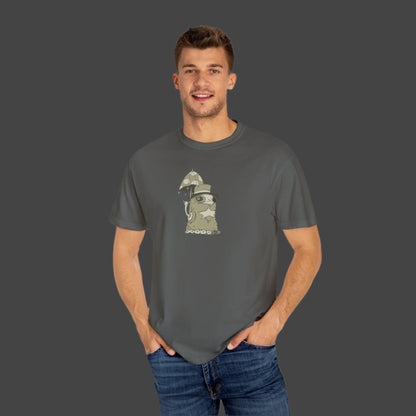 A man in jeans smiles at the camera with hands in his pockets, wearing a Printify Funky Monster T-shirt featuring the Uptown Lester design, showing off his unique artistic style.