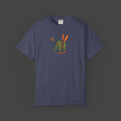 The Flying Elephant Unisex T-shirt by Printify, designed by Jarrod Eastman, features a whimsical navy blue elephant with orange wings and colorful red, orange, and green accents for an inspirational, eye-catching look.