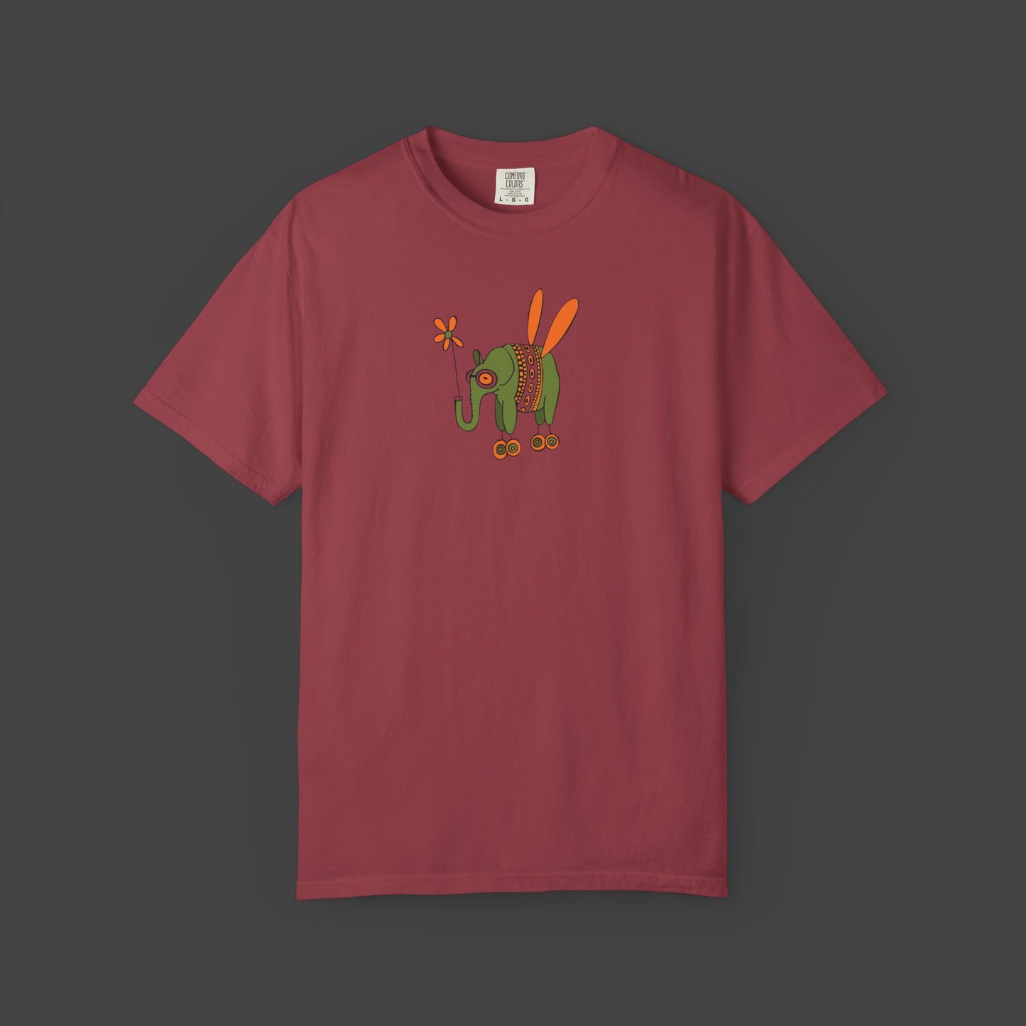 The Printify Flying Elephant Unisex T-shirt by Jarrod Eastman features an inspirational and fun maroon design with a colorful insect illustration on the chest.