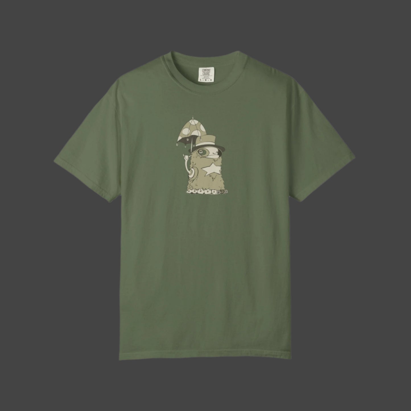 The Funky Monster T-shirt by Printify features the Uptown Lester design—an olive green tee with a whimsical cartoon character chilling under a mushroom umbrella, perfect for fans of artistic and unique apparel.