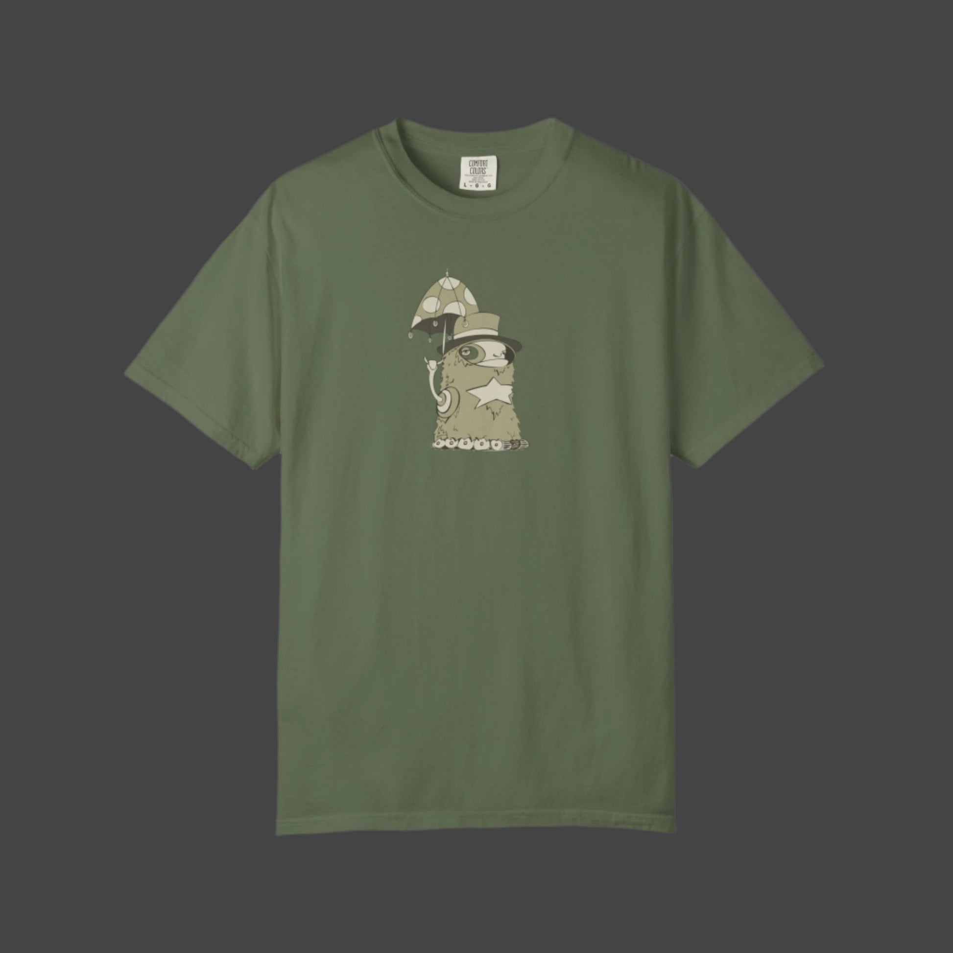 The Funky Monster T-shirt by Printify features the Uptown Lester design—an olive green tee with a whimsical cartoon character chilling under a mushroom umbrella, perfect for fans of artistic and unique apparel.