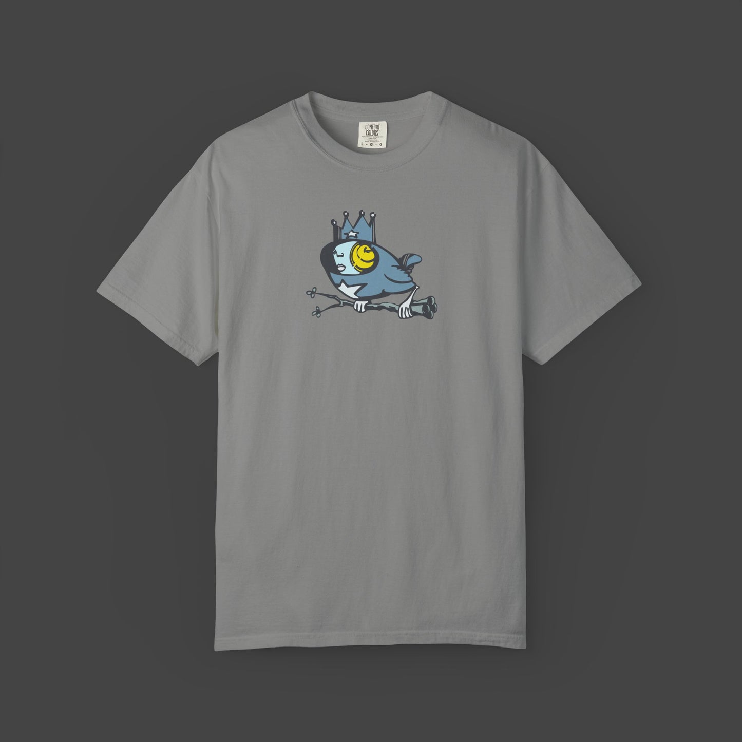 The Biddy Unisex T-shirt by Jarrod Eastman features a quirky surreal bird cartoon with a crown and bold yellow eye
