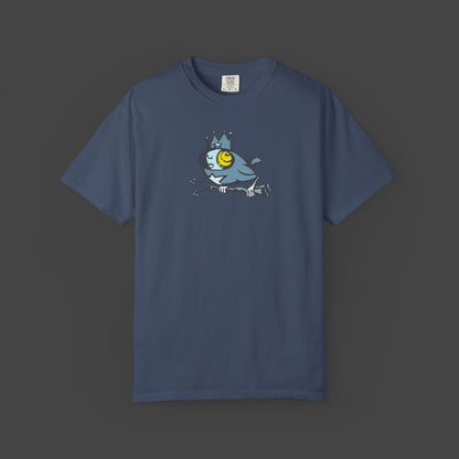 Biddy is a surreal bird unisex T-shirt by Jarrod Eastman. A whimsical blue bird with a human-like face, wearing a crown and holding a branch with its claws.