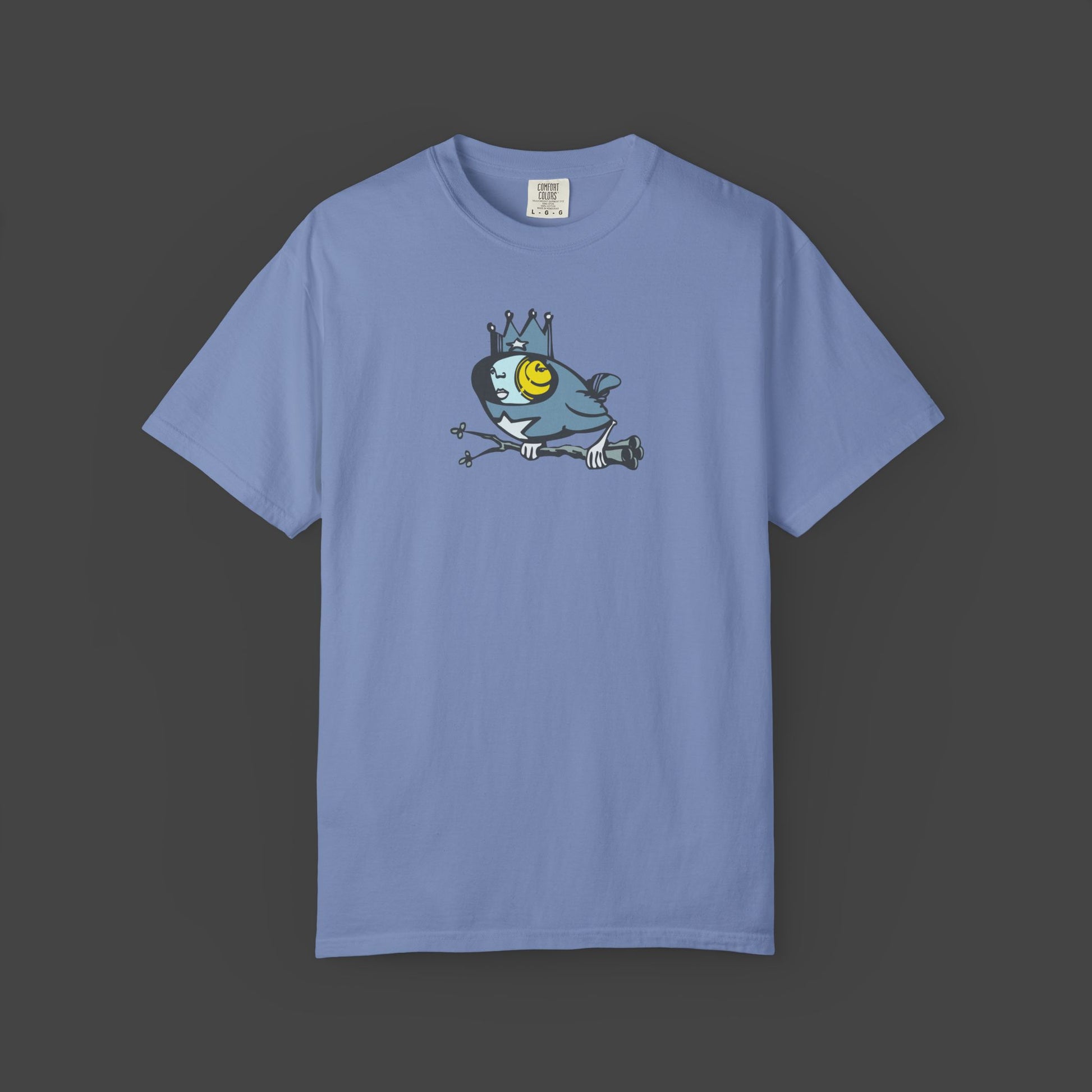 Biddy a Surreal Bird Unisex T-shirt in blue by Jarrod Eastman features quirky surreal bird art, centered on the chest, set against a dark gray background.