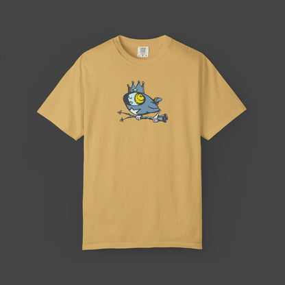 The Biddy Unisex yellow T-shirt by Jarrod Eastman. A whimsical blue bird with a human-like face, wearing a crown and holding a branch with its claws.