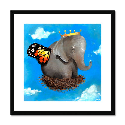 "Surreal elephant with monarch wings and crown resting in a nest of dreams." framed in black
