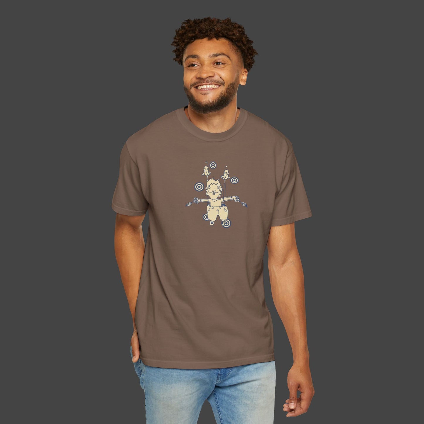 A smiling man wears a Surreal, inspirational, and funny Unisex T-shirt - The Day I Learned to Fly by Jarrod Eastman