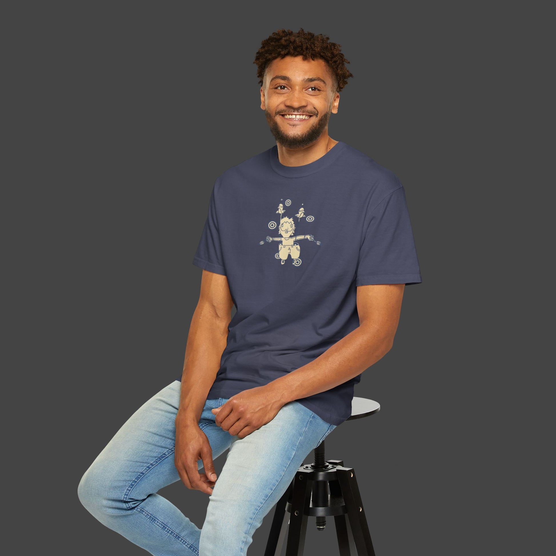 A smiling man with short curly hair wears The Day I Learned to Fly unisex T-shirt by Jarrod Eastman